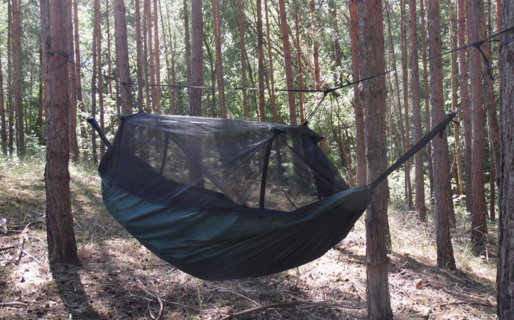 The mosquito net with the spreader bars provides plenty of space in the Frontline hammock to read books without the net getting in the way.